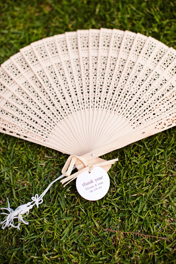 Wedding favor - Opened fan with thank you card attached - photo by San Francisco based wedding photographer Meg Perotti
